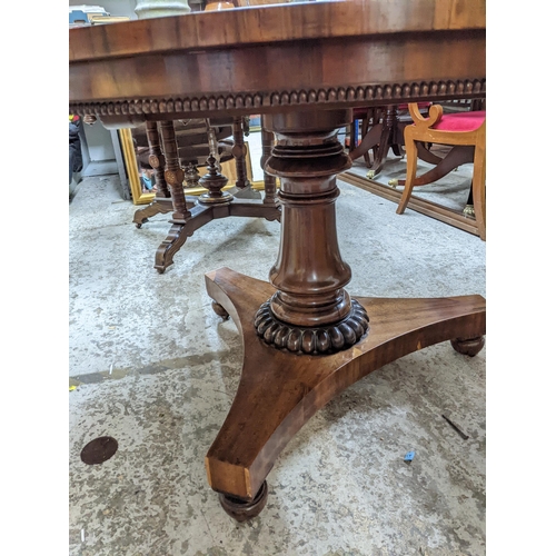 470 - A William IV rosewood breakfast table with gadroon decoration to the frieze apron, vase shaped and r... 