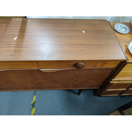 484 - An Elliots of Newbury retro teak sideboard, 75.5 high x 185.5 wide
Location:A4B
If there is no condi... 