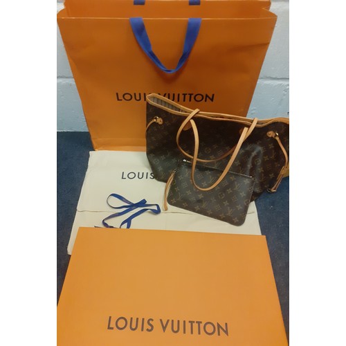 Louis Vuitton-A 2017 Neverfull MM tote bag, 12.6" x 11.4" x 6.7" serial number SF0177, made in France, having a natural cowhide trim and gold tone hardware having an extra removable pouch, iconic orange branded bag, box and dust bag. Location:BWR
Condition:Good, no apparent signs of wear or tear