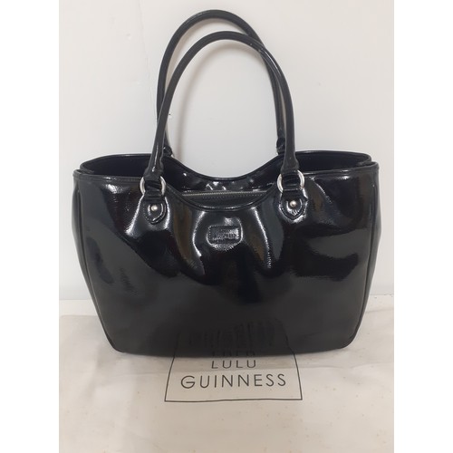 21 - Lulu Guinness- A large black patent handbag 40cm wide x 30cm high having silver tone hardware and re... 