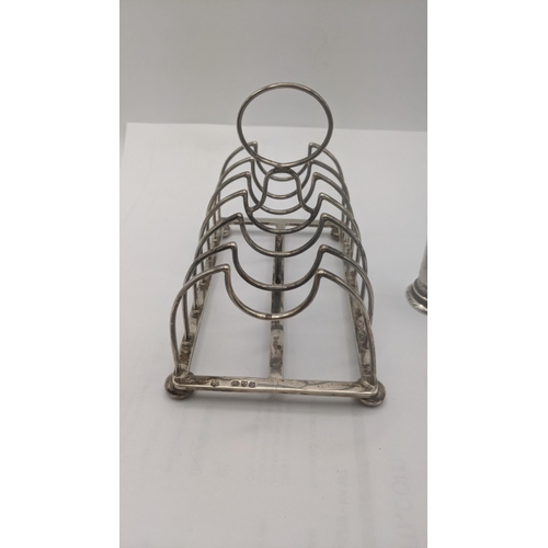 107 - A silver toast rack on four ball feet A/F, together with a pepper pot, total weight 218g
Location:A3... 