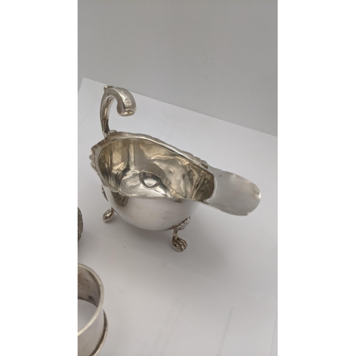 117 - Silver to include a sauce boat, two napkin rings and a dish, total weight 137g
Location:A3T
If there... 