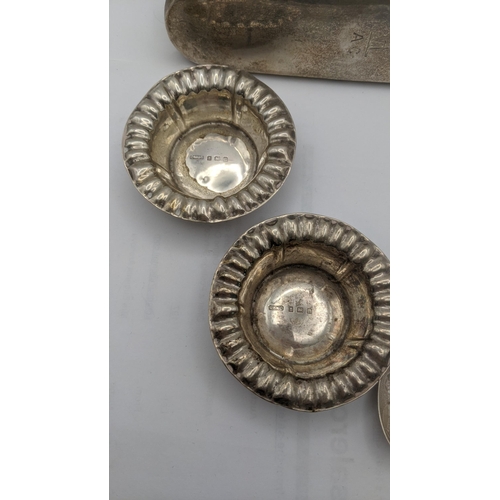 127 - Silver to include two pin dishes, a dressing table brush, a sterling silver spoon, inscribed 'Indian... 