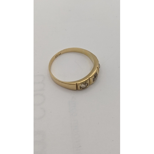 16 - An 18ct gold and three stone diamond ring 3.3g
Location:RING
If there is no condition report shown, ... 