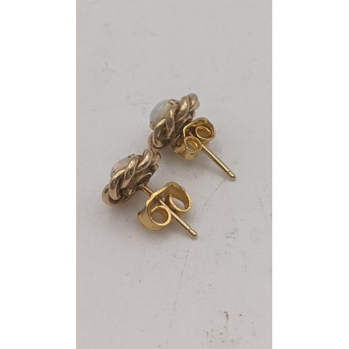 161 - A pair of yellow metal and opal earrings, tested as 9ct gold
Location:CAB4
If there is no condition ... 