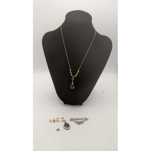 162 - Mixed gold to include a 9ct gold necklace with ruby coloured pendant, a pair of 9ct gold stud earrin... 