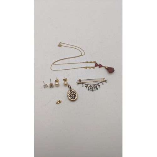 162 - Mixed gold to include a 9ct gold necklace with ruby coloured pendant, a pair of 9ct gold stud earrin... 