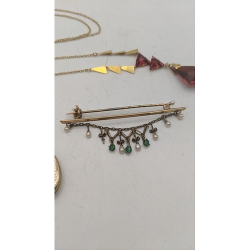 162 - Mixed gold to include a 9ct gold necklace with ruby coloured pendant, a pair of 9ct gold stud earrin... 