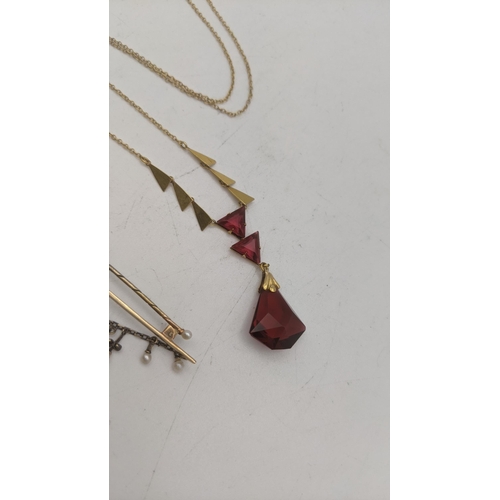 162 - Mixed gold to include a 9ct gold necklace with ruby coloured pendant, a pair of 9ct gold stud earrin... 