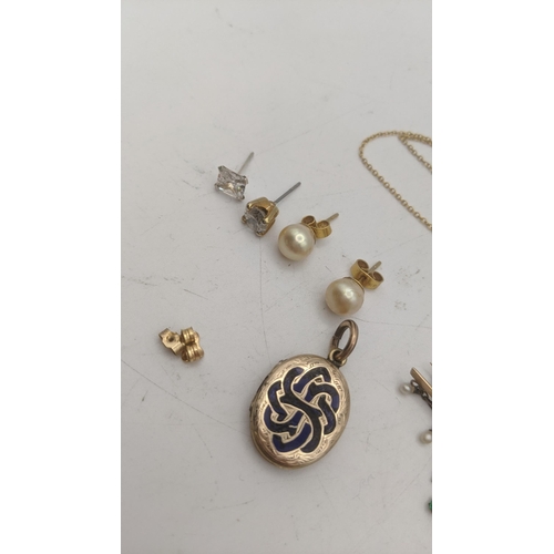 162 - Mixed gold to include a 9ct gold necklace with ruby coloured pendant, a pair of 9ct gold stud earrin... 