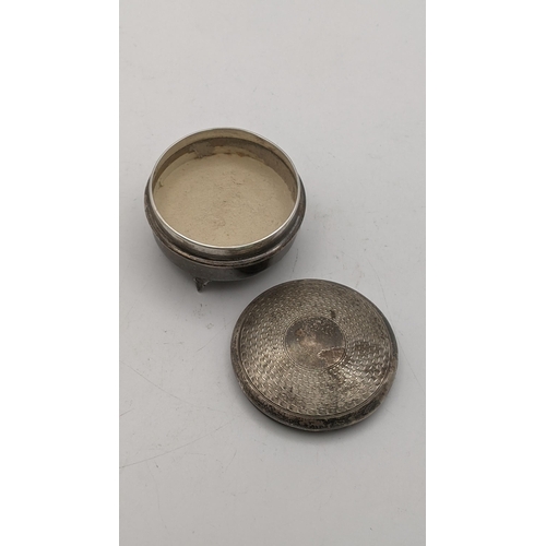 163 - A silver Marson and Jones pill box on three feet having an engine turned designed lid, hallmarked Bi... 