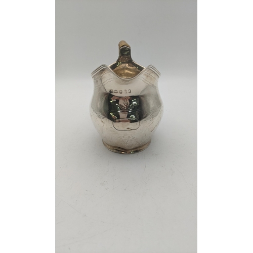 169 - A Regency silver cream jug with a bamboo laced handle and engraved floral detail
Location:A3T
If the... 