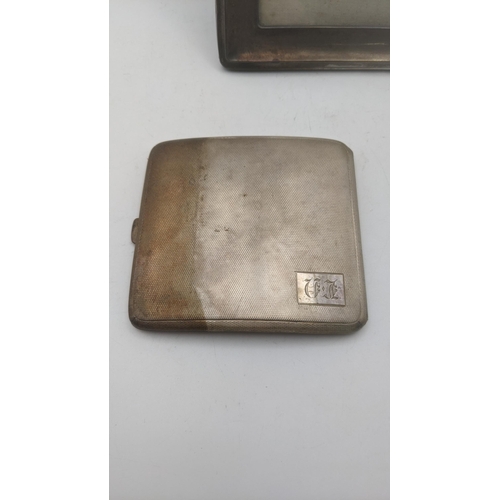 171 - An engine turned silver cigarette case made by W T Toghill & Co, hallmarked Birmingham 1936, 99.2g, ... 