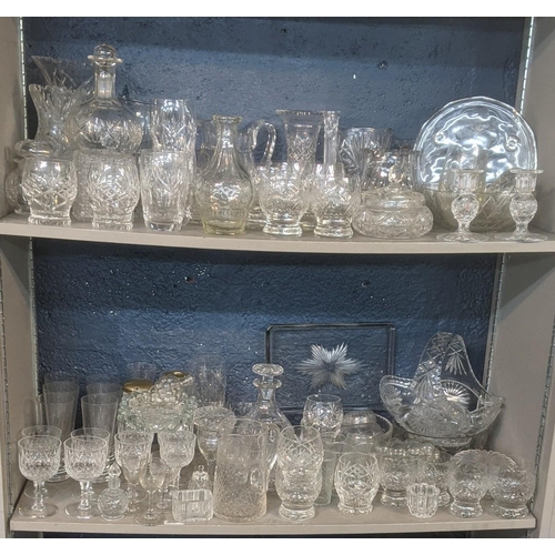 173 - A large quantity of mainly crystal cut glassware comprising of a variety of vases, fruit bowls, deca... 