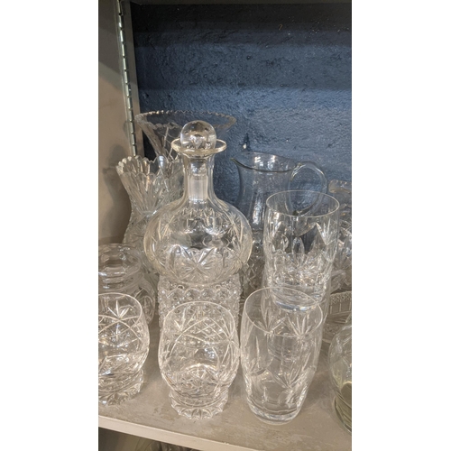 173 - A large quantity of mainly crystal cut glassware comprising of a variety of vases, fruit bowls, deca... 