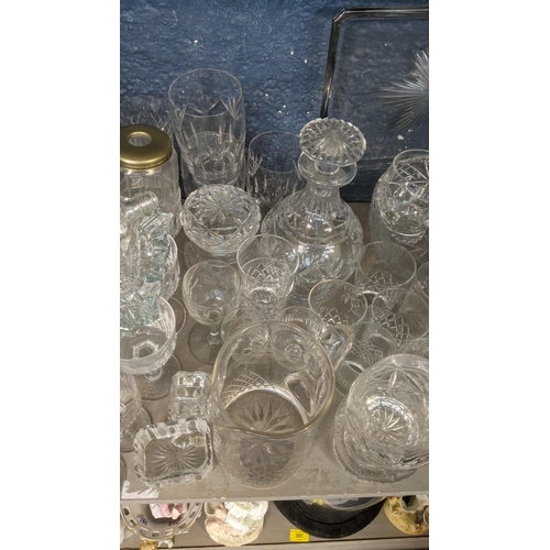 173 - A large quantity of mainly crystal cut glassware comprising of a variety of vases, fruit bowls, deca... 