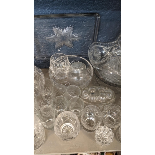 173 - A large quantity of mainly crystal cut glassware comprising of a variety of vases, fruit bowls, deca... 