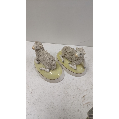 174 - A mixed lot of ceramic and pottery model sheep and goats to include a pair of 19th century Staffords... 