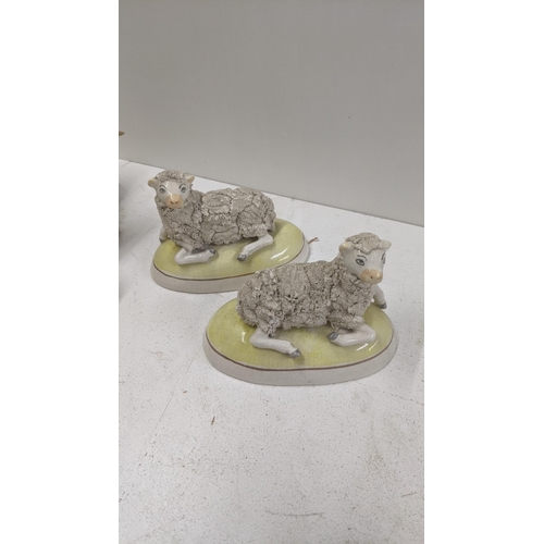 174 - A mixed lot of ceramic and pottery model sheep and goats to include a pair of 19th century Staffords... 