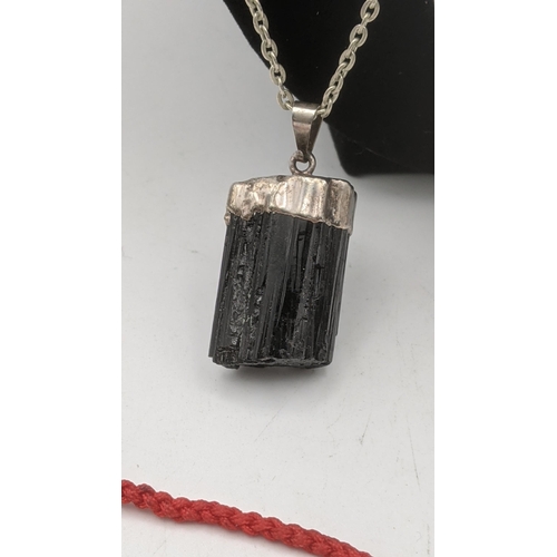 20 - Mixed jewellery to include a raw black Tourmaline pendant on a white metal necklace, silver marcasit... 