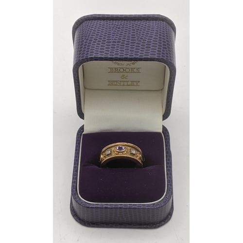 22 - A 9ct gold Brooks & Bentley Jewels of the Coronation ring, set with amethysts, garnet, sapphire and ... 