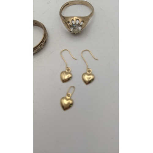 25 - Two ladies gold rings to include a 9ct gold solitaire example set with a past stone, together with a... 