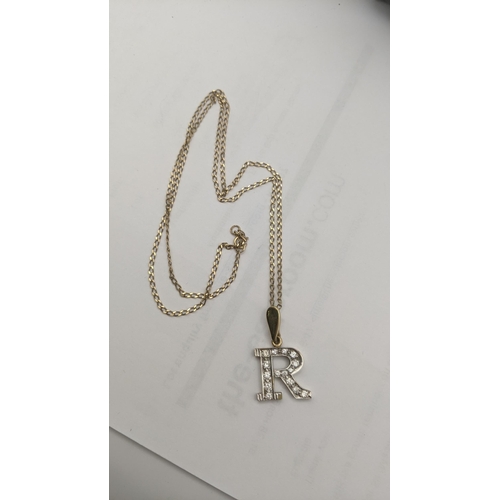 3 - A 9ct gold initial 'R' pendant set with paste stones on a 9ct gold chain necklace, total weight 5.5g... 