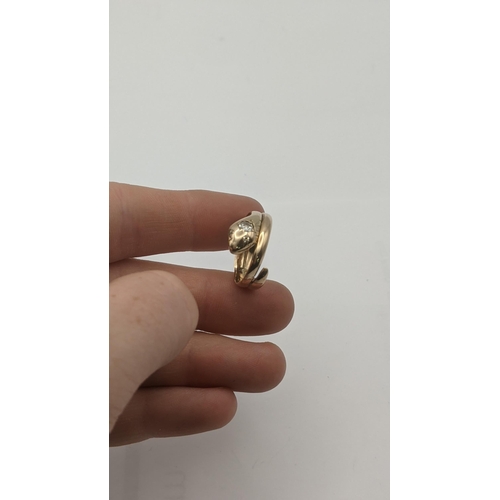 7 - A yellow gold ring fashioned as a snake set with diamonds, tested as 14ct gold, 3.9g
Location:RING
I... 