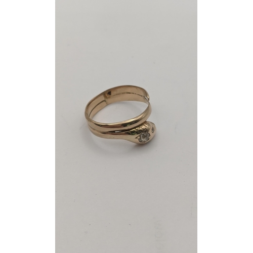 7 - A yellow gold ring fashioned as a snake set with diamonds, tested as 14ct gold, 3.9g
Location:RING
I... 