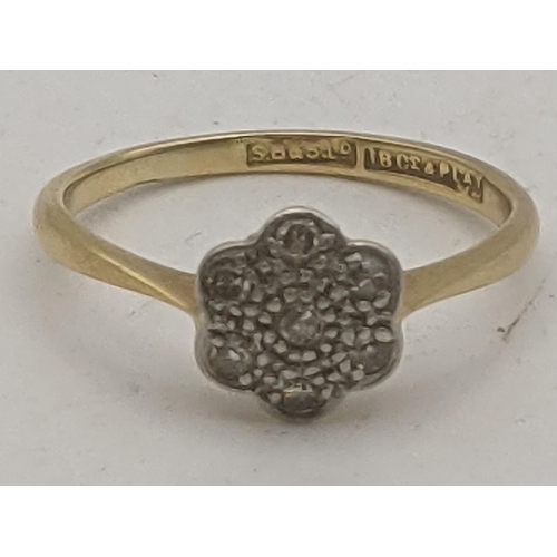 70 - An 18ct gold and platinum diamond daisy ring, size N, 2.2g
Location:RING
If there is no condition re... 