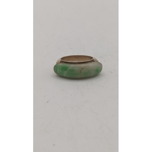 71 - A yellow gold and jadeite ring tested as 9ct gold size L ½ 7.2g
Location:RING
If there is no conditi... 