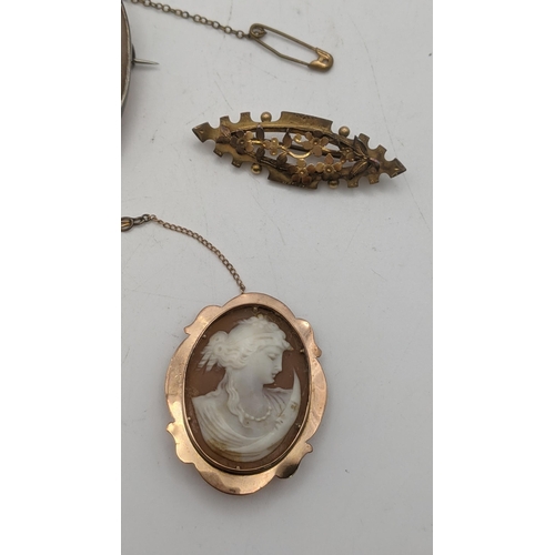 76 - Jewellery to include a Victorian 9ct gold brooch 2.2g, along with a cameo brooch set in 9ct gold wit... 