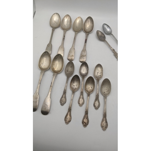 77 - Silver to include 5 fiddle pattern teaspoons, 6 sterling silver teaspoons and a fork total weight 26... 