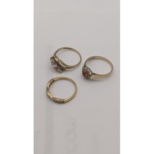 8 - Three 9ct gold lady's ring to include a cluster ring set with a central orange stone, surrounded by ... 