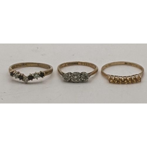 82 - Three 9ct gold rings to include a 9ct platinum and diamond ring size K 1.6g together with a citrine ... 