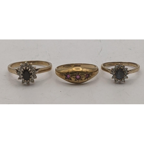 84 - Three 9ct gold ladies rings to include two sapphire and diamond cluster rings, along with a gypsy st... 