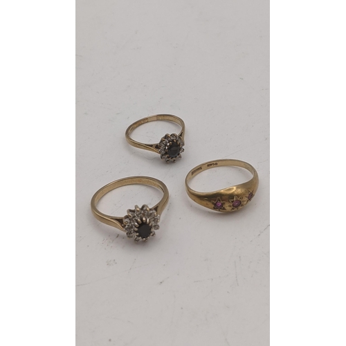 84 - Three 9ct gold ladies rings to include two sapphire and diamond cluster rings, along with a gypsy st... 