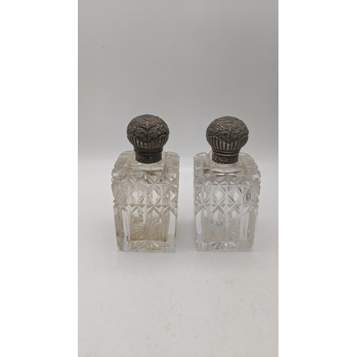 96 - Silver to include a pair of Victorian silver topped, crystal cut glass scent bottles, hallmarked Bir... 