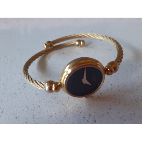 20 - Gucci-A 2700 2L gold plated ladies watch with black dial and rope twist strap. Location:Cab 2
If the... 