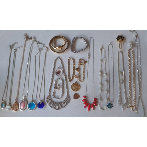 31 - A quantity of vintage and modern costume jewellery to include a fine 9ct gold chain with 9ct gold he... 