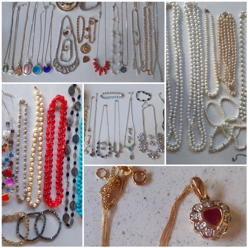 31 - A quantity of vintage and modern costume jewellery to include a fine 9ct gold chain with 9ct gold he... 