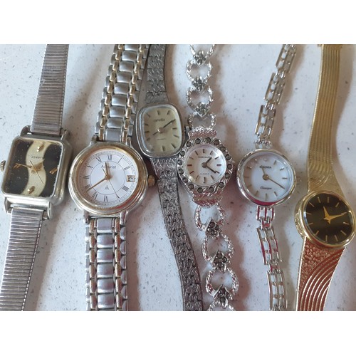 33 - A quantity of ladies watches to include Citizen, Sekonda and Accurist and dressing table items to in... 