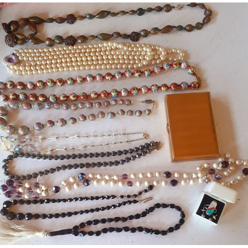 34 - A quantity of vintage costume jewellery, mainly necklaces and brooches, to include marcasite brooche... 