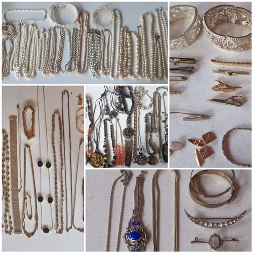 39 - A quantity of vintage and modern costume jewellery comprising 2 silver adjustable bangles, early 20t... 