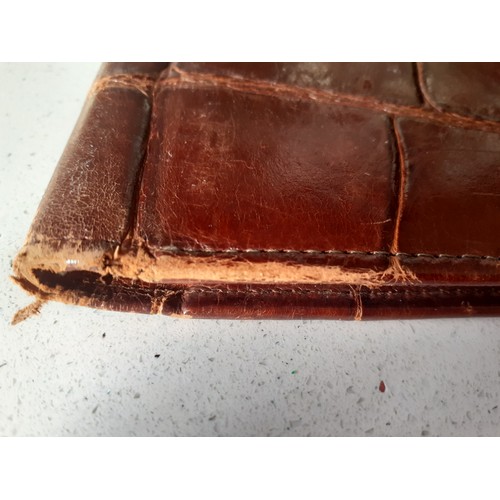 40 - A vintage brown crocodile folio approx 36cm x 28cm together with an early to mid 20th Century cream ... 