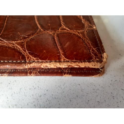 40 - A vintage brown crocodile folio approx 36cm x 28cm together with an early to mid 20th Century cream ... 