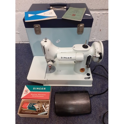 57 - A 1964 cased white Singer No:221k featherweight 'Red S' sewing machine, serial number EV971266 with ... 