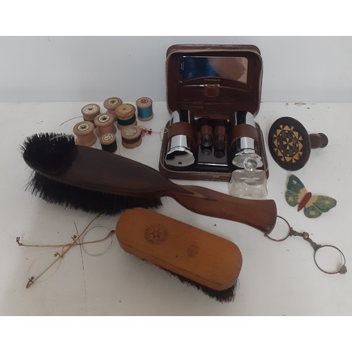 526 - A mixed lot to include vintage wooden cotton reels, clothes brushes, a gentleman's brown leather van... 