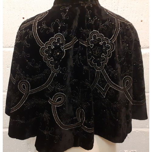 35 - A Victorian black velvet cape with embroidery and beadwork, approx 15