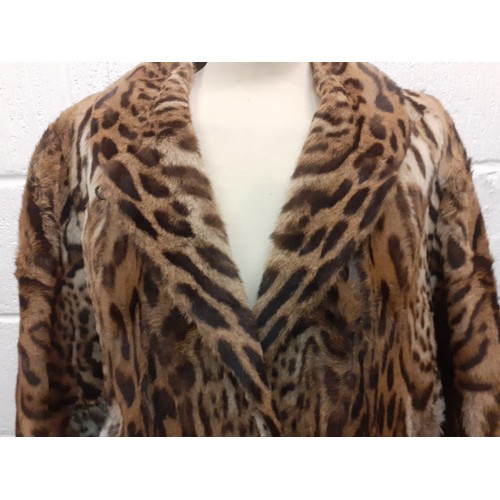 46 - A vintage ocelot fur coat, approx 40